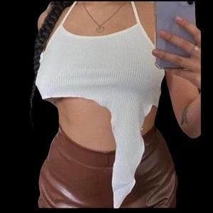 Asymmetrical halter style tie back white ribbed top

never worn.
